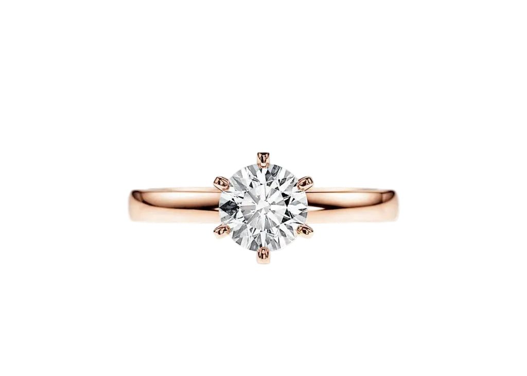 Close-up of a D-color VVS1 round moissanite held by six elegant, sophisticated gold prongs.