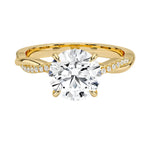 Four-claw cat-claw round brilliant moissanite ring with a single pavé vine twist band in yellow gold ApolloGem.