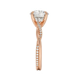 Top-down view of a D-color VVS1 round stone in an asymmetrical rose gold cat-claw setting.