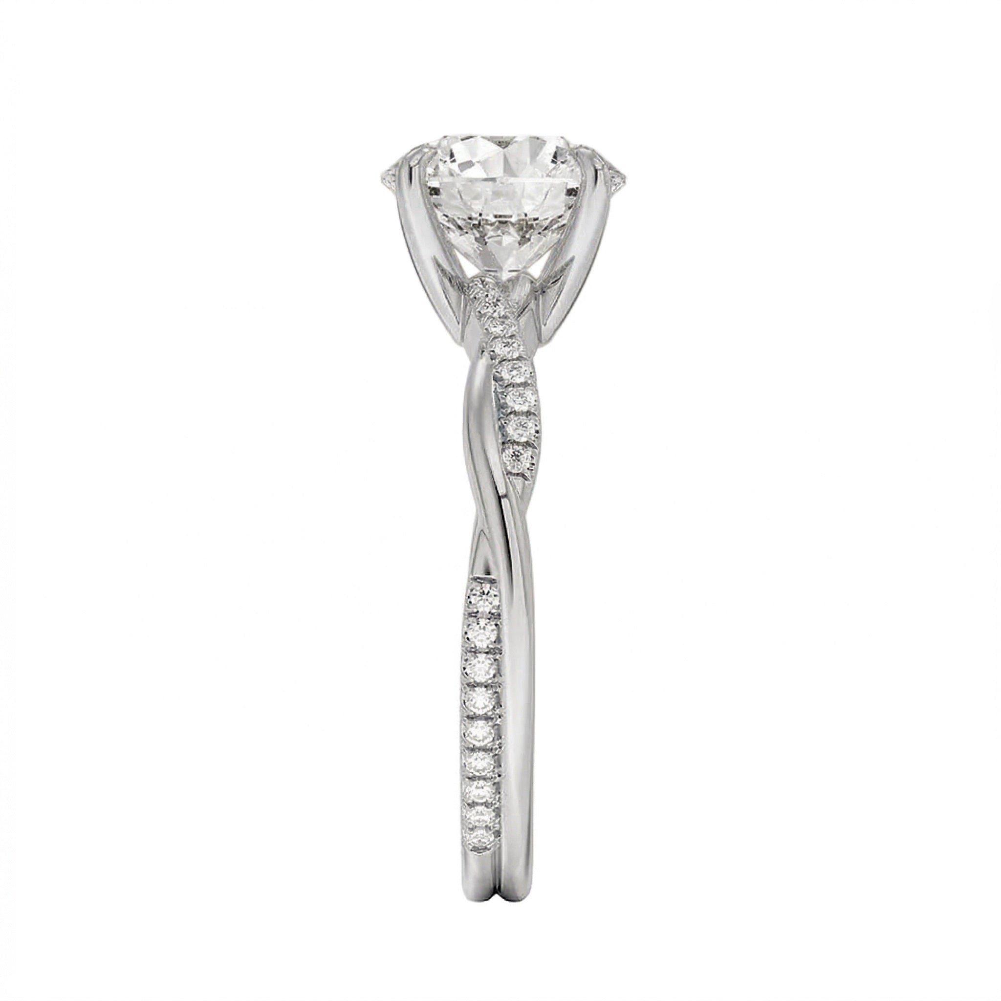 Top-down view of a D-color VVS1 round stone in an asymmetrical white gold cat-claw setting.