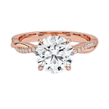 Four-claw cat-claw round brilliant moissanite ring with a single pavé vine twist band in rose gold ApolloGem.