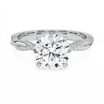 Four-claw cat-claw round brilliant moissanite ring with a single pavé vine twist band in white gold ApolloGem.