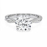 Four-claw cat-claw round brilliant moissanite ring with a single pavé vine twist band in white gold ApolloGem.