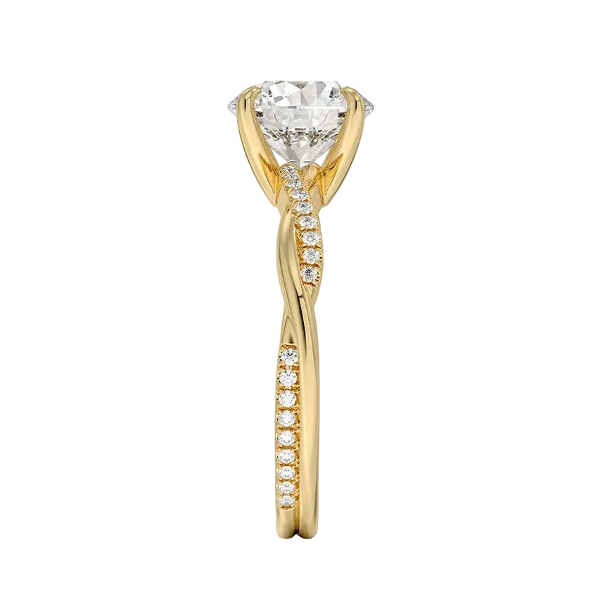 Top-down view of a D-color VVS1 round stone in an asymmetrical yellow gold cat-claw setting.