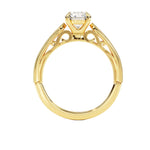 Top-down view of a D-color VVS1 round brilliant moissanite in a yellow gold solitaire setting.