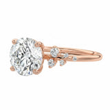 Top-down view of a symmetrical round brilliant ring with shimmering pavé accents on a polished yellow gold comfort-fit shank.