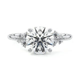 Unique bridal stack featuring a round stellar moissanite ring paired with a matching gold wedding band for a high-glamour look.