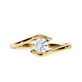 Round brilliant moissanite engagement ring with a modern yellow gold tension setting ApolloGem.