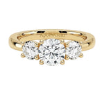 Classic round brilliant moissanite trilogy engagement ring in yellow gold ApolloGem.
