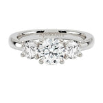 Classic round brilliant moissanite trilogy engagement ring in white gold gold ApolloGem.