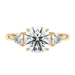 Luxury round brilliant moissanite engagement ring in yellow gold featuring structural trillion cut side stones ApolloGem South Africa.