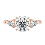 Luxury round brilliant moissanite engagement ring in rose gold featuring structural trillion cut side stones ApolloGem South Africa.