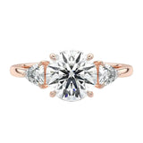 Luxury round brilliant moissanite engagement ring in rose gold featuring structural trillion cut side stones ApolloGem South Africa.