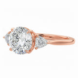 Classic three-stone round moissanite engagement ring Detailed side view of a round moissanite ring showing the secure setting and geometric trillion-shaped side accents