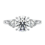 Close-up of a high-quality GRI certified D-color VVS1 round brilliant moissanite with sharp trillion side stones.