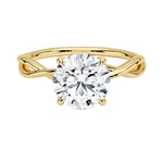 Round brilliant moissanite engagement ring with a twisted infinity-style yellow gold band ApolloGem.