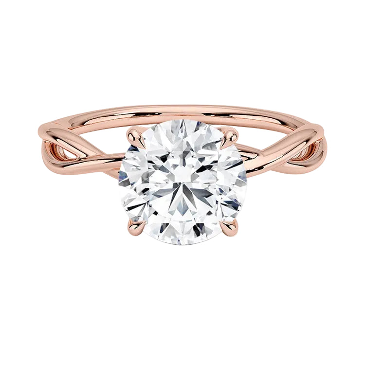 Round brilliant moissanite engagement ring with a twisted infinity-style rose gold band ApolloGem.