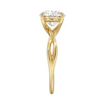 Symmetrical top-down view of a round moissanite solitaire on a decorative twisted gold band.