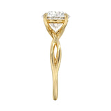 Symmetrical top-down view of a round moissanite solitaire on a decorative twisted gold band.