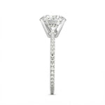 Top-down view of a D-color VVS1 round brilliant moissanite in a white gold solitaire setting.