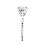 Top-down view of a D-color VVS1 round brilliant moissanite in a white gold solitaire setting.