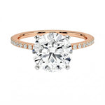 Integrated secure white gold claws on a warm gold sculpted solitaire band ApolloGem
