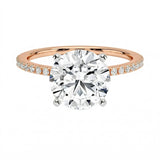 Integrated secure white gold claws on a warm gold sculpted solitaire band ApolloGem
