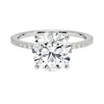 Integrated secure white gold claws on a warm gold sculpted solitaire band ApolloGem