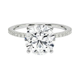 Integrated secure white gold claws on a warm gold sculpted solitaire band ApolloGem