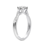 V-split round engagement ring on a finger showing the sophisticated architectural silhouette and shine