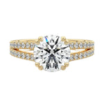 Secure double-claw round brilliant moissanite ring with a V-split pavé gold band ApolloGem.
