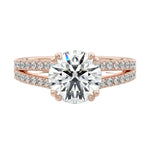 Secure double-claw round brilliant moissanite ring with a V-split pavé gold band ApolloGem.
