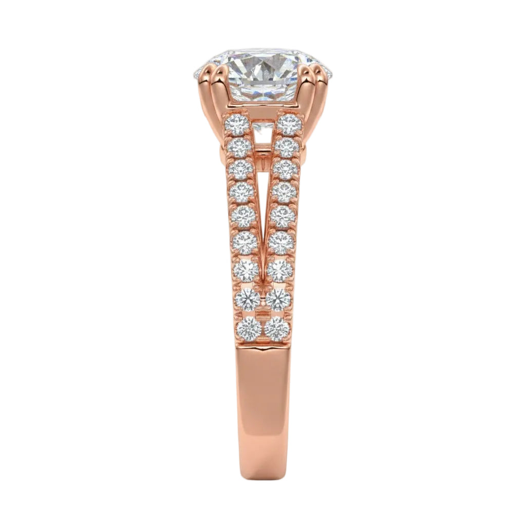 Top-down view of a D-color VVS1 round stone in a rose gold double-claw split-shank setting.