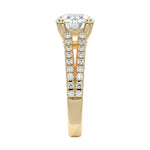 Top-down view of a D-color VVS1 round stone in a yellow gold double-claw split-shank setting.
