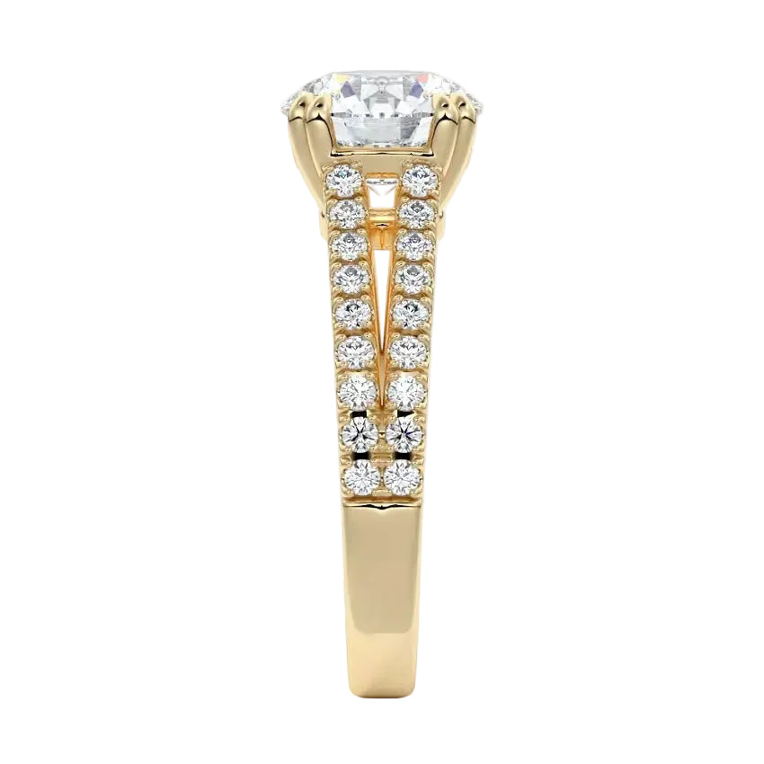 Top-down view of a D-color VVS1 round stone in a yellow gold double-claw split-shank setting.