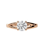 Close-up of a D-color VVS1 round moissanite held by elegant, sophisticated pin-claws.