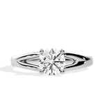 Close-up of a D-color VVS1 round moissanite held by elegant, sophisticated pin-claws.