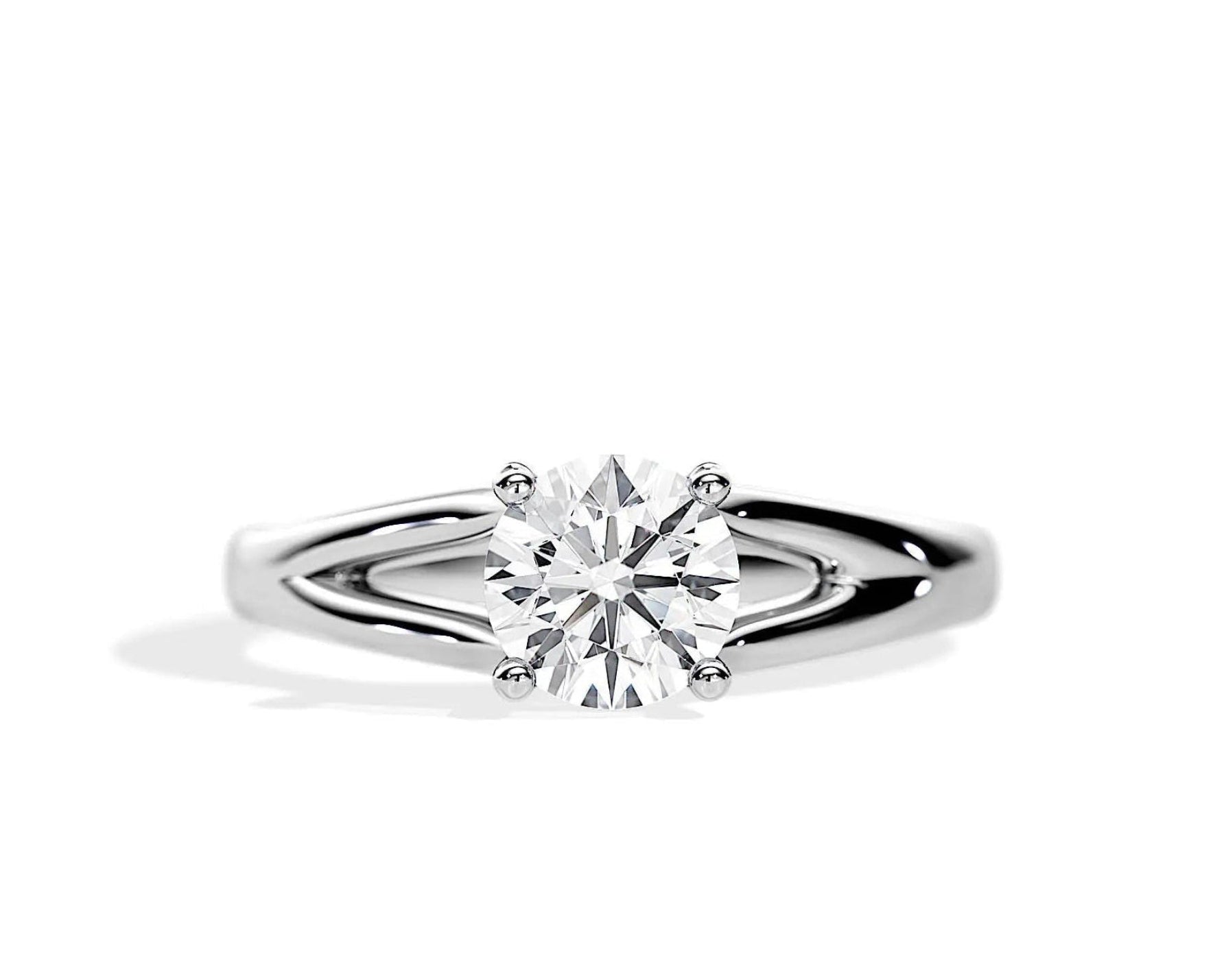 Close-up of a D-color VVS1 round moissanite held by elegant, sophisticated pin-claws.
