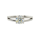 Dainty four-claw round brilliant moissanite ring on an asymmetric V-shape wishbone white gold band ApolloGem.