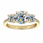 Three-stone moissanite trilogy engagement ring with round brilliant diamonds and a pavé band, handcrafted by ApolloGem South Africa.