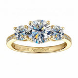 Three-stone moissanite trilogy engagement ring with round brilliant diamonds and a pavé band, handcrafted by ApolloGem South Africa.