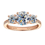 Three-stone moissanite trilogy engagement ring with round brilliant diamonds and a pavé band, handcrafted by ApolloGem South Africa.