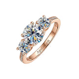 Detailed side view of the Royal Trinity ring showing the three-stone setting and micro-pavé accents.