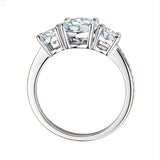 Three-stone round brilliant engagement ring with a shimmering pavé shank and GRI certified stones.