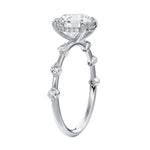 Top-down view of the rhythmic flat white gold band with stones set in pairs