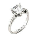 Side profile of the Royal Solitaire ring showing the intricate sculpted scrolls and refined shared-prong integration