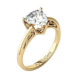 Side profile of the Royal Solitaire ring showing the intricate sculpted scrolls and refined shared-prong integration