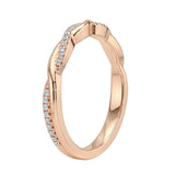 Close-up of a moissanite eternity ring featuring a braided metal and diamond-like vine design.
