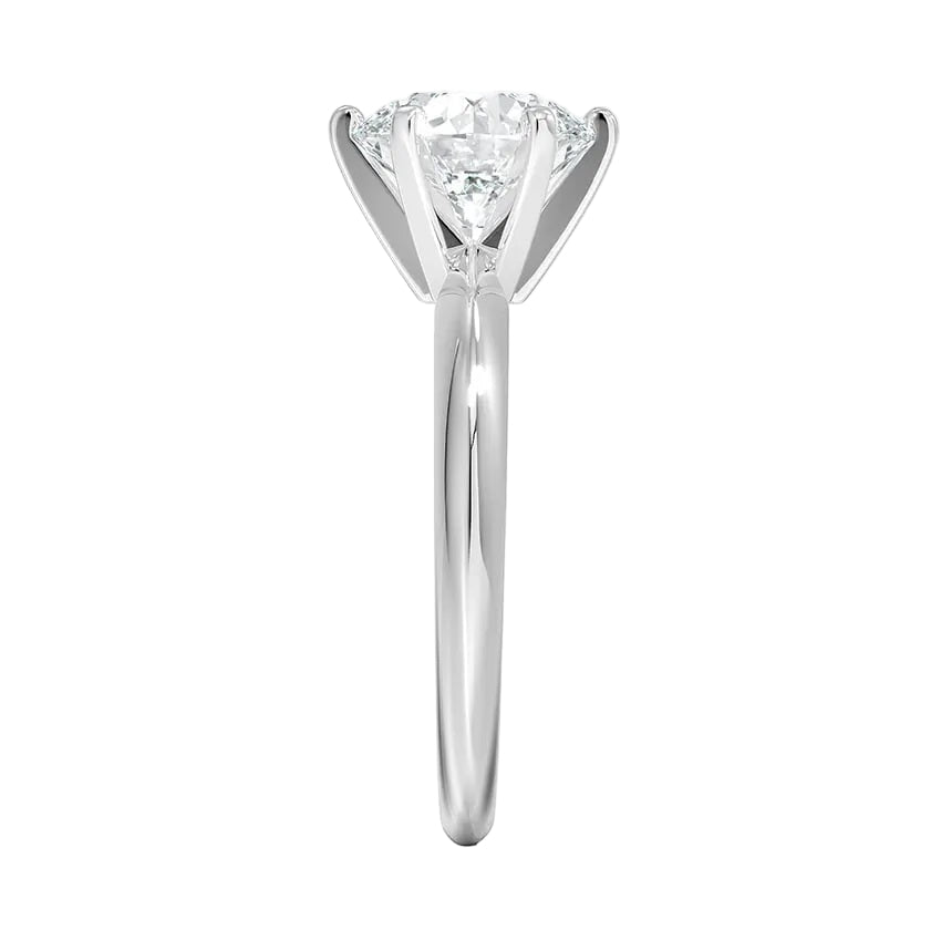 Round cut Moissanite lab grown diamond engagement ring round shank with a six claw setting, on a gold band, against a white background.Moissanite engagement ring cape town south africa grand diamonds ralph jacobs jeuli