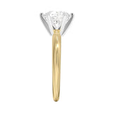 Detailed side view of a two-tone ring showing the yellow gold band and white gold six-prong crown setting.